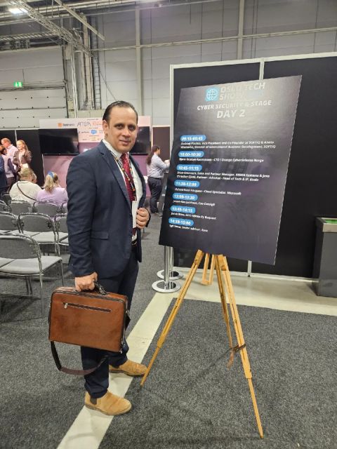 Khawar Mahmood attending a technology event beside the Cyber Security Stage programme